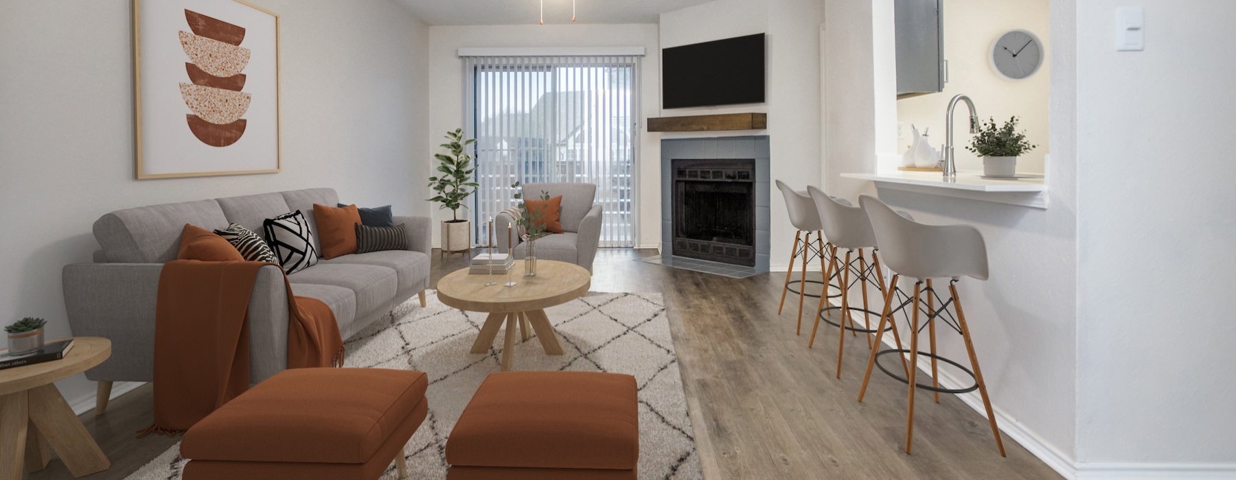 A living room with a couch, chairs, and a fireplace in a one bedroom apartment in McKinney, TX at Oaklyn.