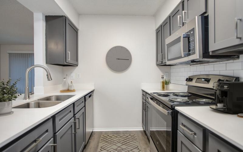 a kitchen with black appliances